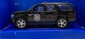 Chevrolet Tahoe '08 czarny police 1:34 Welly 43607