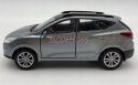 Hyundai Tucson IX niebieski 1:34 Welly 43648F