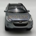 Hyundai Tucson IX niebieski 1:34 Welly 43648F