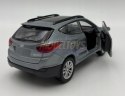 Hyundai Tucson IX niebieski 1:34 Welly 43648F