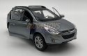 Hyundai Tucson IX niebieski 1:34 Welly 43648F