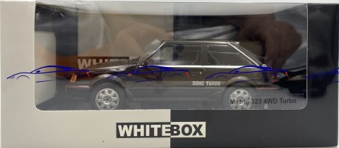 Mazda 323 4WD Turbo 1989 model 124222 WhiteBox 1:24 czarny Mazda 323 4WD Turbo 1989 model 124222 WhiteBox 1:24 czarny