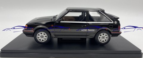 Mazda 323 4WD Turbo 1989 model 124222 WhiteBox 1:24 czarny Mazda 323 4WD Turbo 1989 model 124222 WhiteBox 1:24 czarny